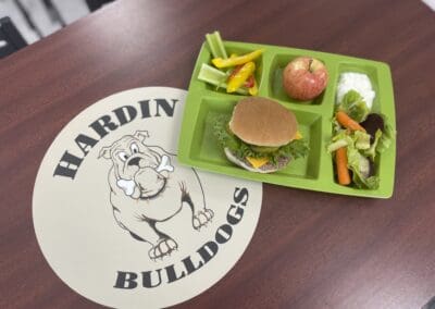 Table that says Hardin Bulldogs and a tray of lunch food.